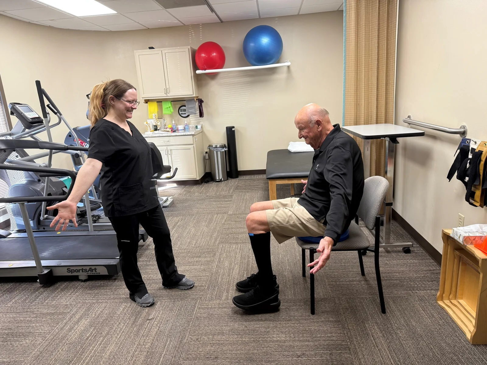 A clinician guiding a patient through core strengthening exercises