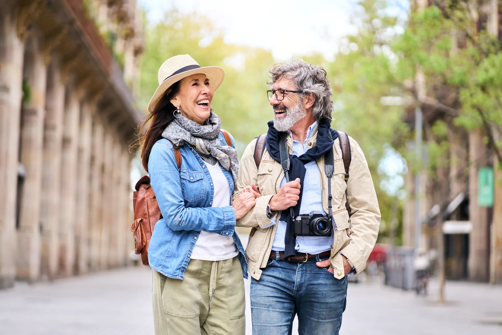 A couple walking and talking together outdoors