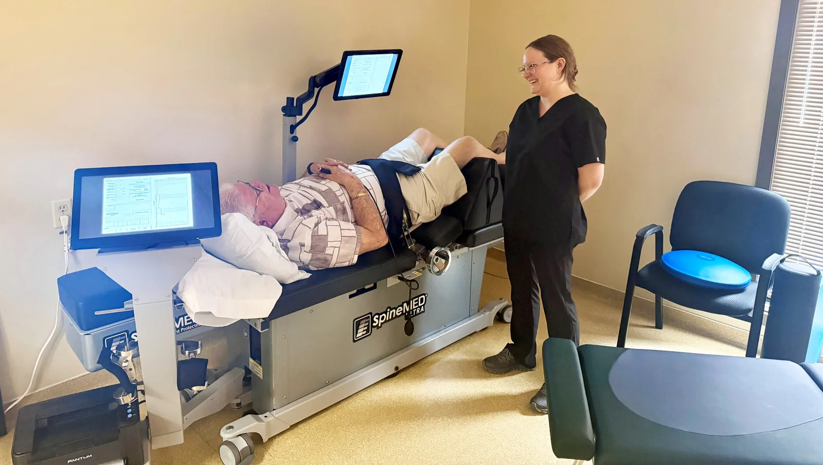 A patient being treated on the SpineMED® spinal decompression table